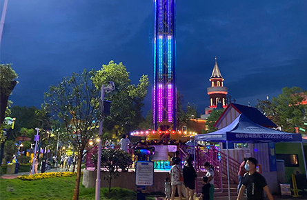rotary tower ride with dazzling lights